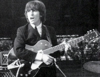 Джордж Харрисон с гитарой