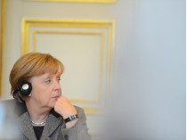Меркель призвала Путина использовать свое влияние на боевиков
