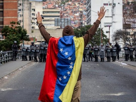 Демонстрант в Каракасе