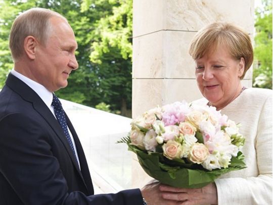 Путін та Меркель
