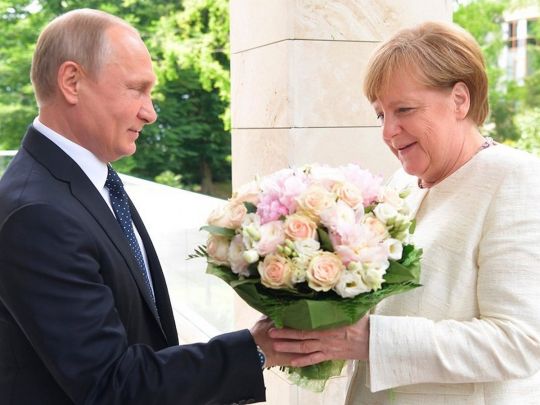 Путін та Меркель