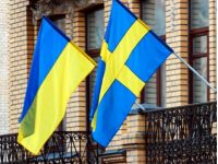 Флаги Украины и Швеции