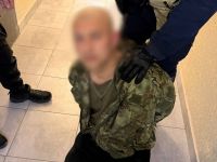 В Киеве задержан мужчина с арсеналом оружия - Фото: Национальная полиция